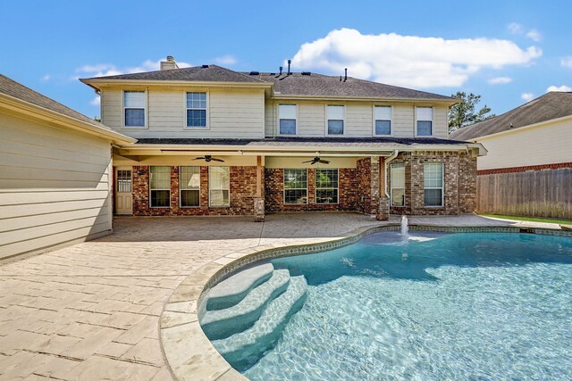 view of pool with a patio area and ceiling fan