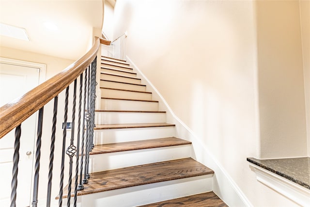 staircase featuring hardwood / wood-style floors