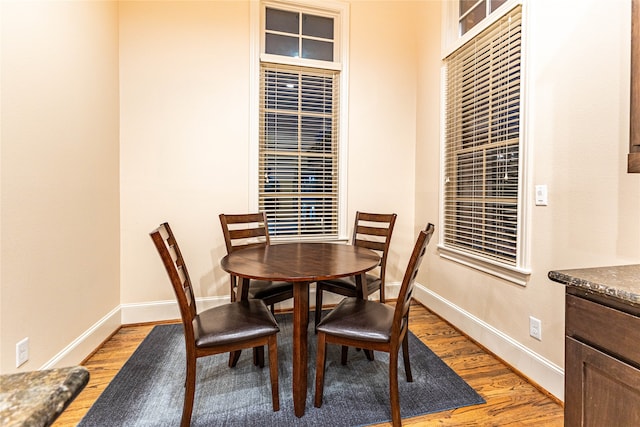 dining space featuring light wood-type flooring