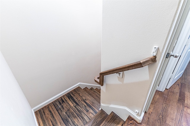 staircase featuring hardwood / wood-style floors