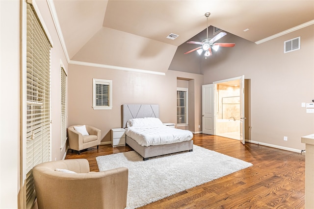 bedroom with ensuite bathroom, ceiling fan, lofted ceiling, and dark wood-type flooring