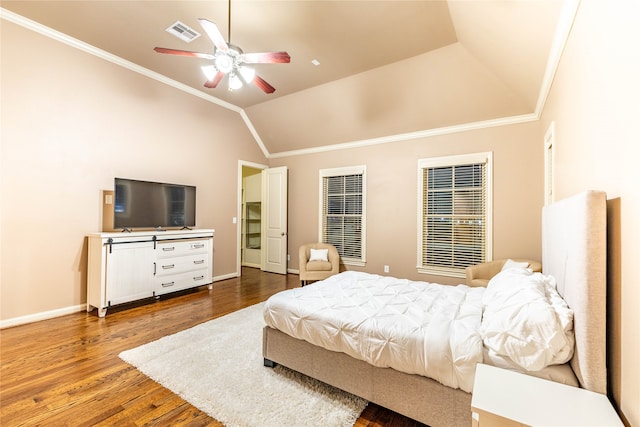 bedroom featuring ceiling fan, hardwood / wood-style floors, lofted ceiling, and ornamental molding