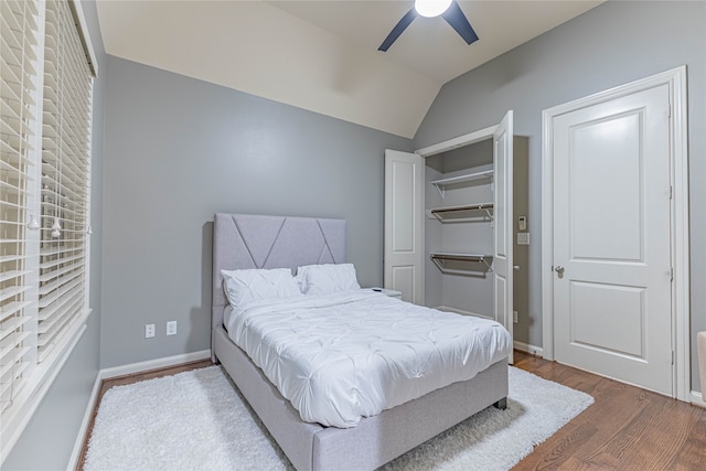 bedroom featuring wood-type flooring, ceiling fan, and lofted ceiling