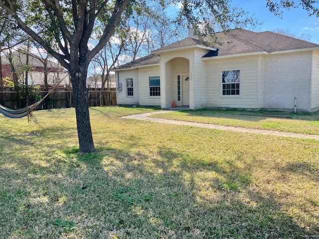 ranch-style house with a front lawn