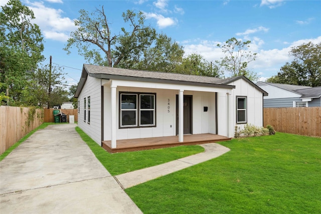 view of front of house featuring a front yard and covered porch