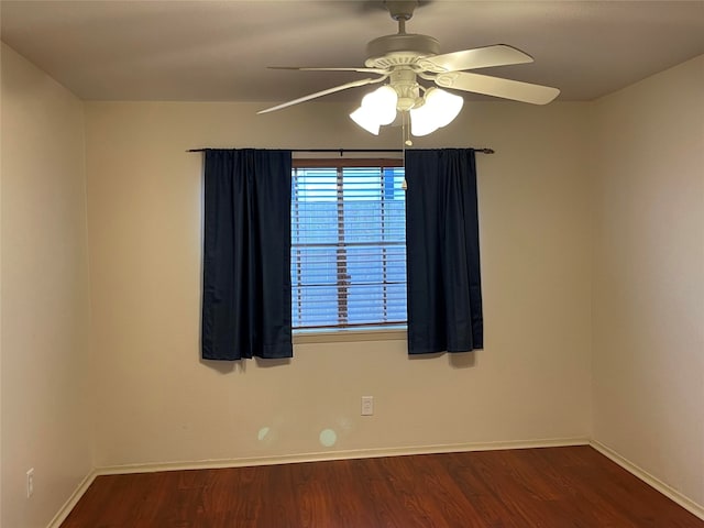 empty room featuring ceiling fan and wood-type flooring