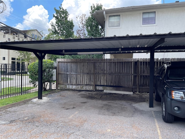 view of parking / parking lot featuring a carport