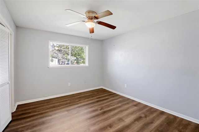 unfurnished bedroom with ceiling fan, dark hardwood / wood-style floors, and a closet