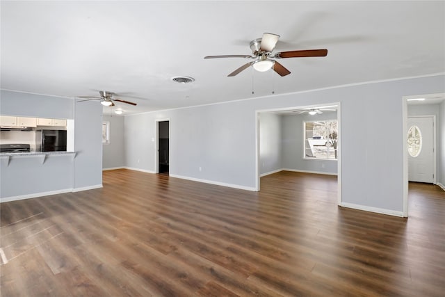 unfurnished living room with dark hardwood / wood-style floors