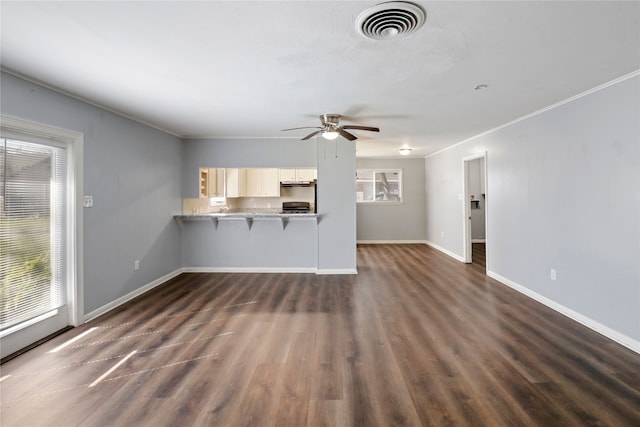 unfurnished living room featuring ceiling fan and dark wood-type flooring