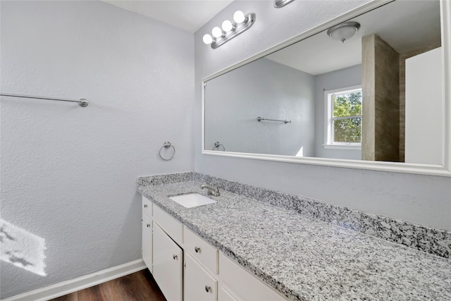 bathroom featuring vanity and wood-type flooring