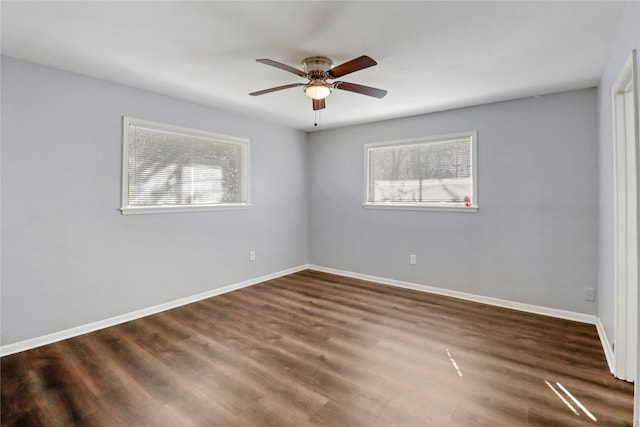 empty room featuring dark hardwood / wood-style floors and ceiling fan