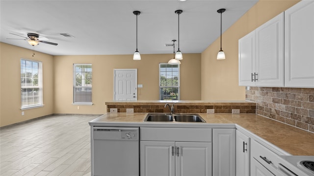 kitchen featuring white appliances, white cabinets, and sink