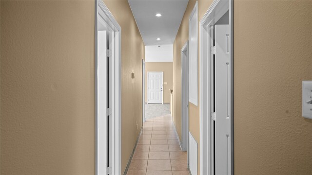 503 12th St, San Leon, TX 77539 - hallway with light tile patterned flooring, a textured wall, and recessed lighting