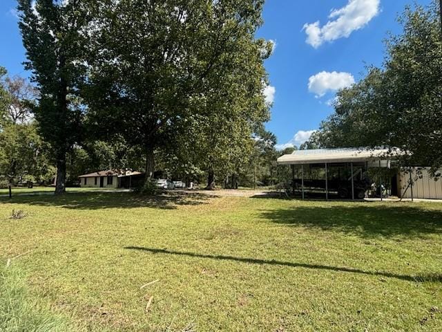 view of yard with a carport