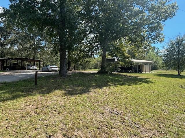 view of yard with a carport