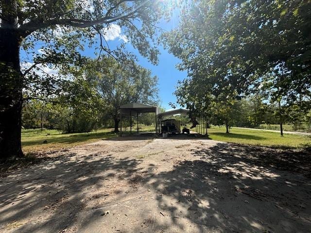 view of yard with a carport