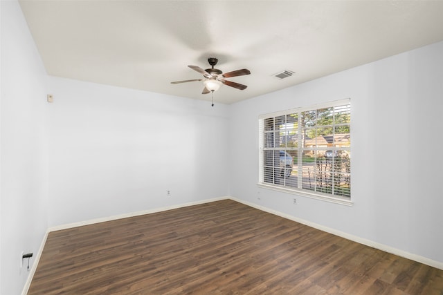 unfurnished room featuring dark hardwood / wood-style flooring and ceiling fan