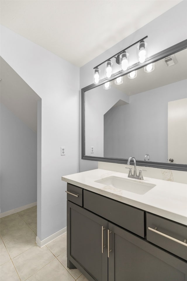 bathroom with tile patterned flooring and vanity