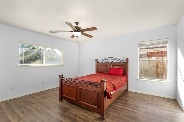 bedroom featuring ceiling fan and dark wood-type flooring