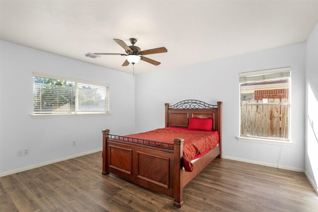 bedroom featuring ceiling fan and dark hardwood / wood-style flooring