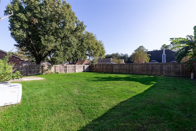 view of yard featuring central AC unit