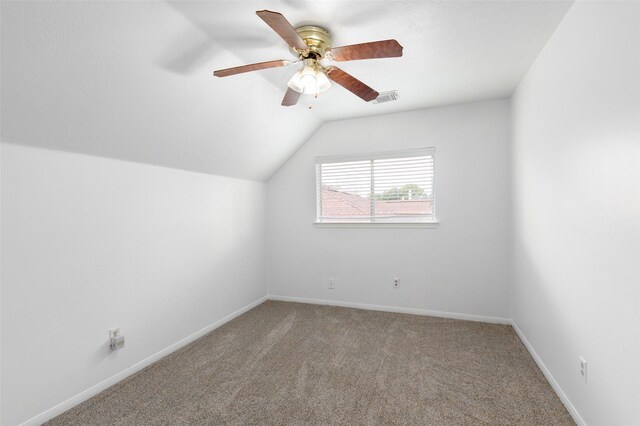 bonus room with vaulted ceiling, ceiling fan, and carpet flooring