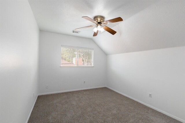 bonus room with lofted ceiling, carpet flooring, and ceiling fan