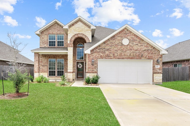 view of front property with a front yard and a garage