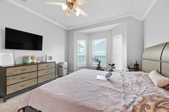 bedroom featuring ceiling fan, carpet floors, lofted ceiling, and ornamental molding