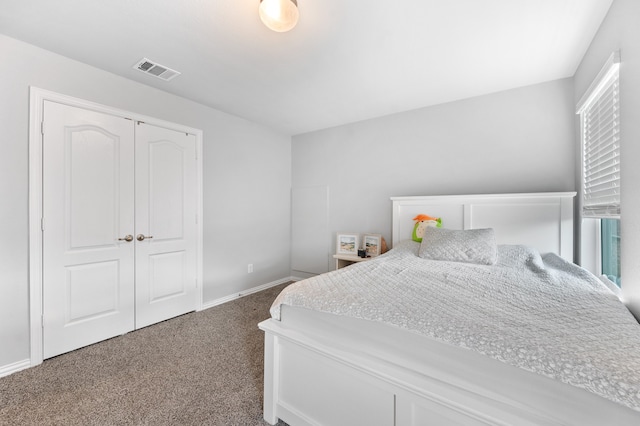 carpeted bedroom featuring a closet