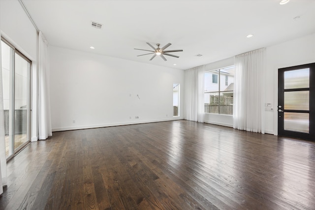 unfurnished room with dark wood-type flooring and ceiling fan