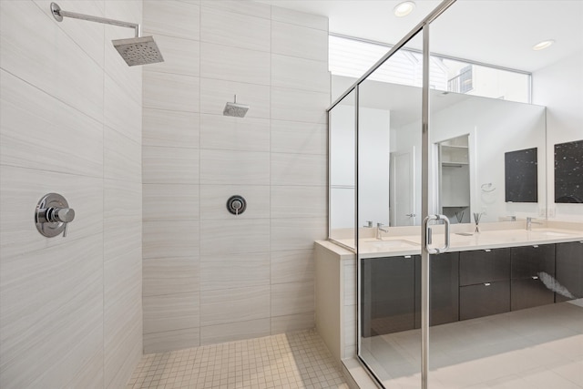 bathroom with vanity, tile patterned floors, and tiled shower