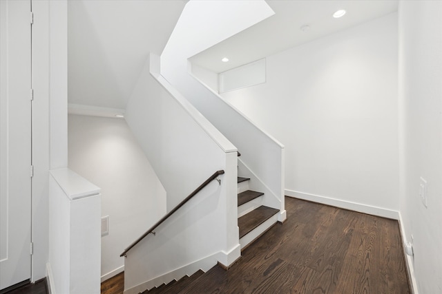 stairway with hardwood / wood-style floors