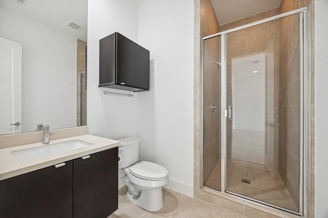 bathroom featuring vanity, tile patterned floors, toilet, and an enclosed shower