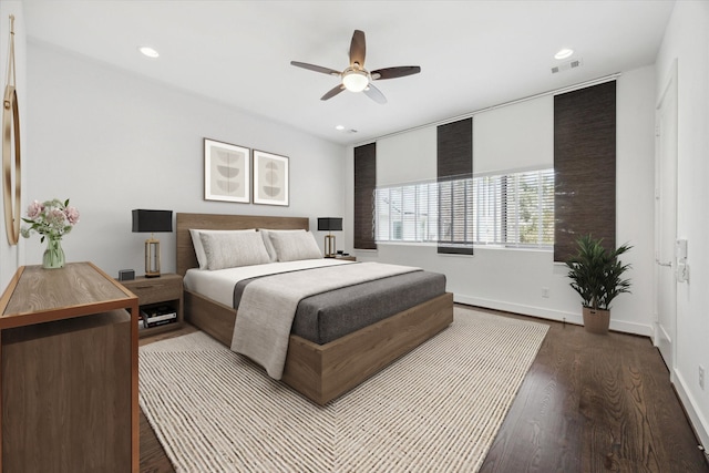 bedroom featuring ceiling fan and dark hardwood / wood-style flooring