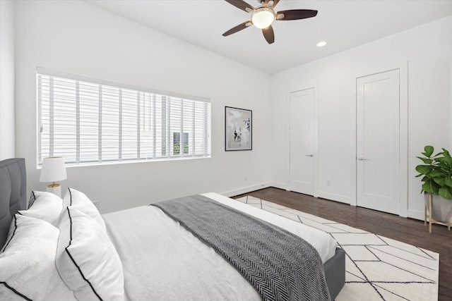 bedroom featuring dark hardwood / wood-style floors and ceiling fan