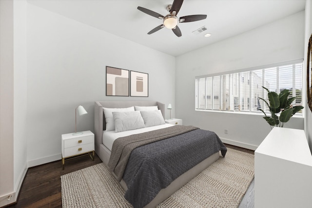 bedroom with dark wood-type flooring and ceiling fan