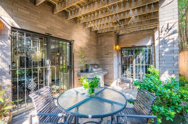 view of patio / terrace with outdoor dining space and a grill