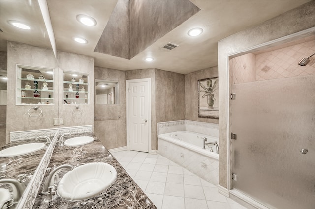 bathroom featuring tile patterned floors, vanity, and plus walk in shower