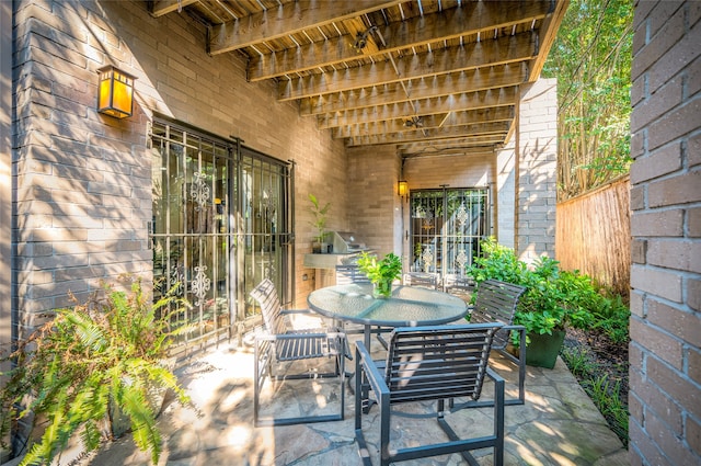 view of patio / terrace with outdoor dining space and a grill