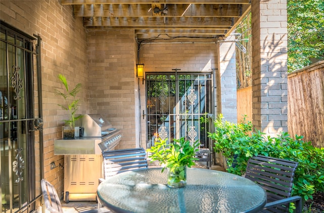 view of patio featuring area for grilling and outdoor dining area