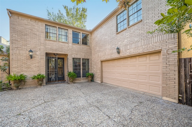 view of front of house with brick siding and driveway