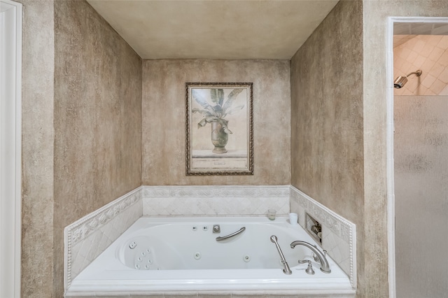 bathroom with tiled bath