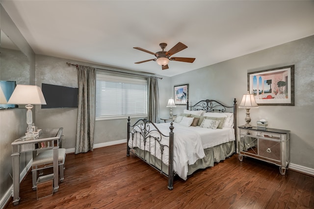 bedroom with dark hardwood / wood-style flooring and ceiling fan