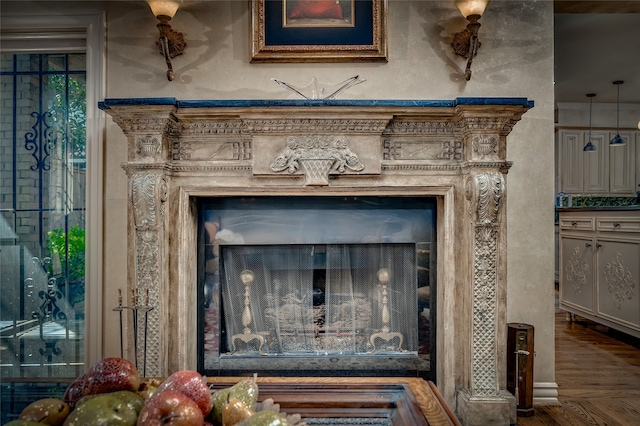 interior details featuring wood finished floors and a fireplace