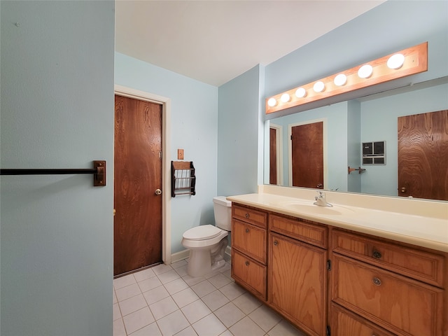 bathroom featuring vanity, toilet, and tile patterned floors