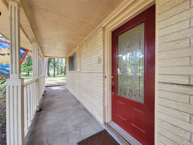 doorway to property with a porch