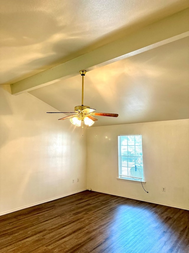 empty room featuring dark hardwood / wood-style floors, lofted ceiling with beams, and ceiling fan