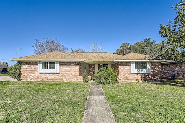 ranch-style home with a front yard